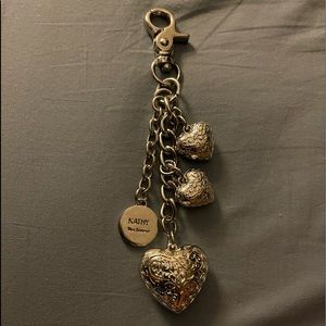 Silver tone Kathy Van Zeeland heart purse charm.